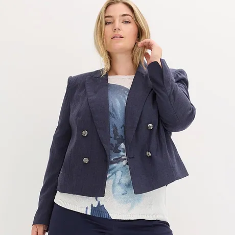 Marineblauwe blazer over een blauw gemêleerde top.