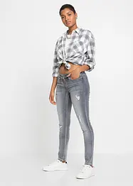 Skinny jeans met destroyed effecten, bonprix