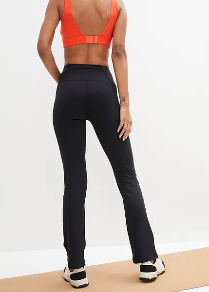 Sneldrogende sportlegging van super stretch met een klein ritszakje en een elastische band flared. zwart