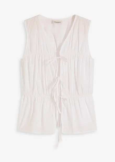 Mouwloze blouse met volants en strikjes